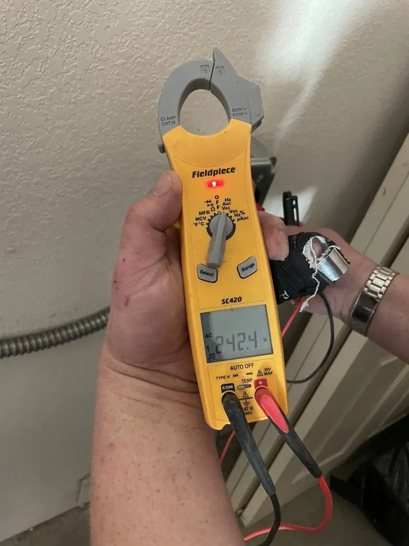 Voltage testing with clamp meter during Outlet Installation in Lake Elsinore